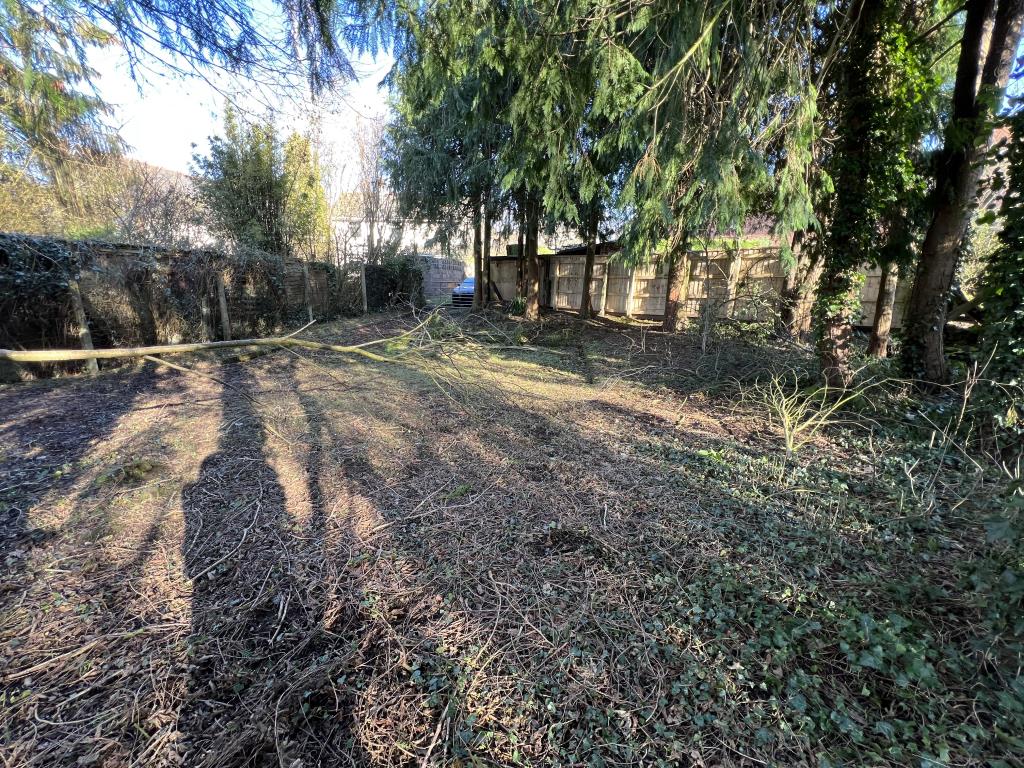 Lot: 3 - AREA OF LAND WITH ACCESS TRACK IN VILLAGE LOCATION WITH POTENTIAL - General view of the land towards gate